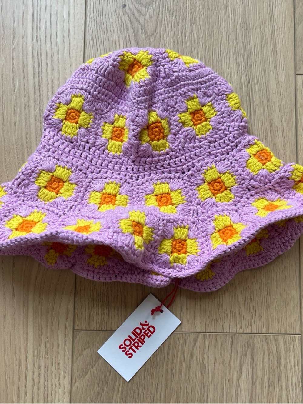 SOLID & STRIPED Pink Crochet Bucket Hat with Yellow & Orange Floral Motifs